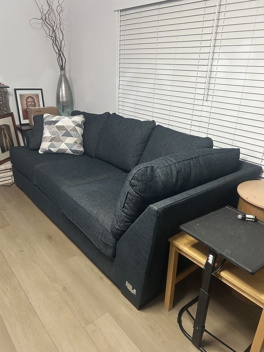 Dark Blue living room couch (100.5in long, 44in wide and 32in high)