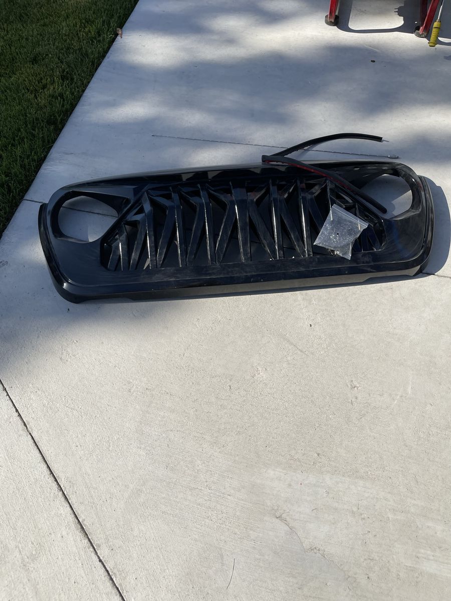 Black Jeep Wrangler Grille Replacement Front Grill Part for 2017 or newer Jeep Wrangler. Painted Black never installed.
