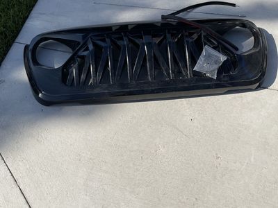 Black Jeep Wrangler Grille Replacement Front Grill Part for 2017 or newer Jeep Wrangler. Painted Black never installed.