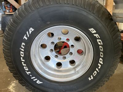 Dodge 35 12.50 8 lug rims and tires for sale.