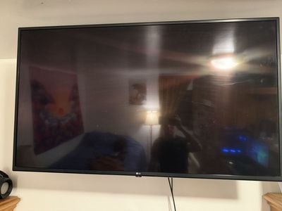 LG 55” 4K UHD Smart TV + Wall Mount