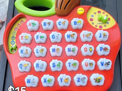 VTech Apple Alphabet, LeapFrog Fridge Phonics, Lakeshore Geometric Shapes, and Learning Resources Ta