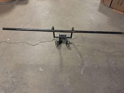 Dumpster lock bar with dump release.