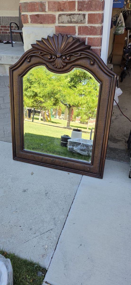 Decorative Brown Wooden Wall Mirror with Ornate Scalloped Top
