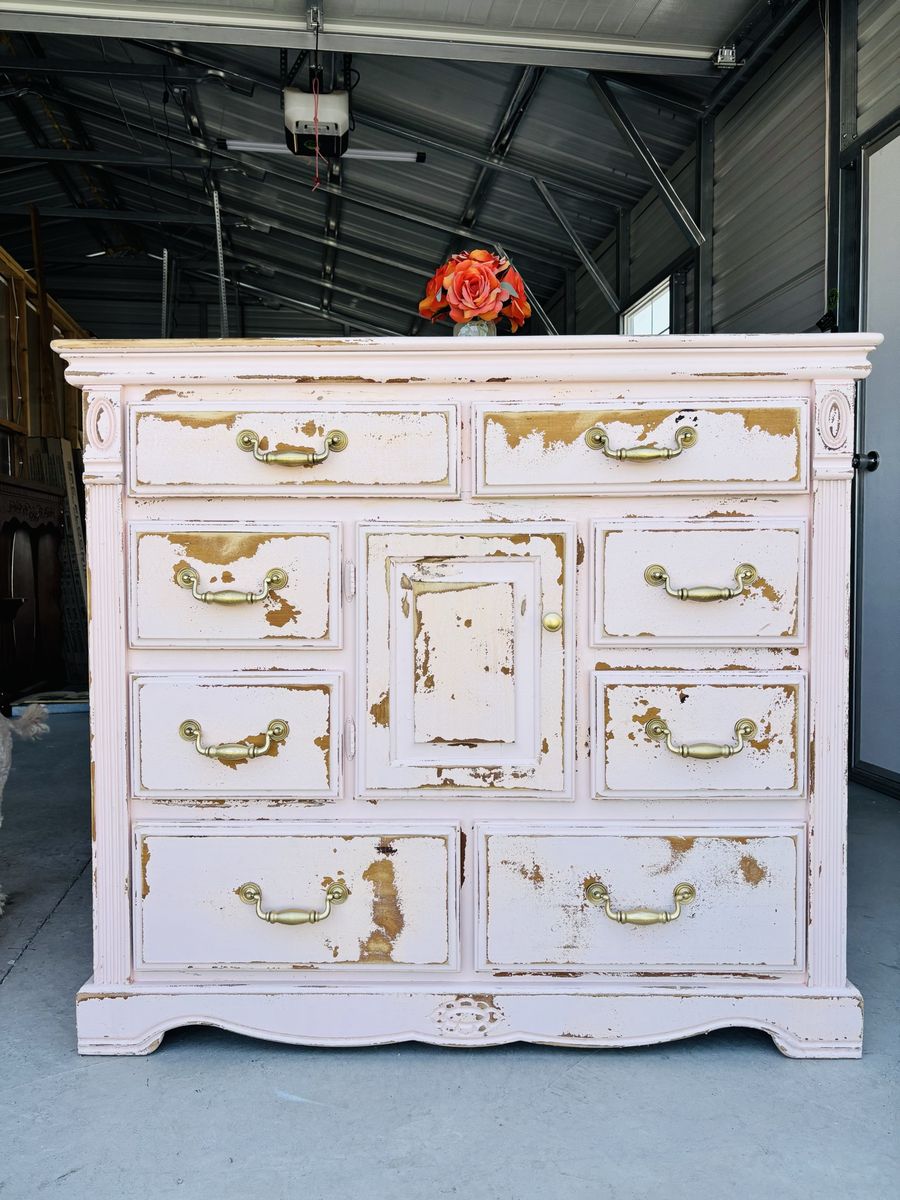 Distressed Light Pink Wooden Dresser with Brass Handles and Center Cabinet