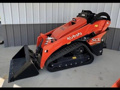 mini skid, dump trailer, operator