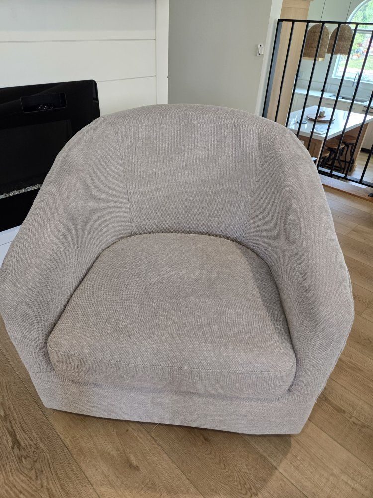 Rotating gray barrel chair for sale