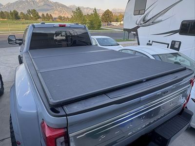 Ford F-Series Super Duty Truck Bed Tonneau Cover Black hard Tri-Fold. Less than a few hundred miles on cover.