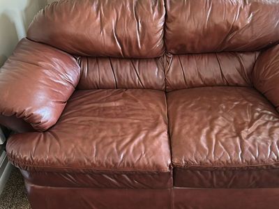 Brown leather loveseat