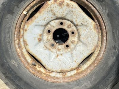 Michelin 245/R17. Used Steel Wheel and Tire with Significant Rust