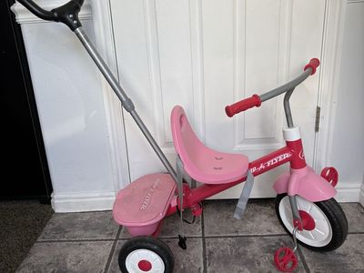 Radio Flyer Pink 4-in-1 Stroll 'N Trike - Toddler Push Tricycle with Parent Handle