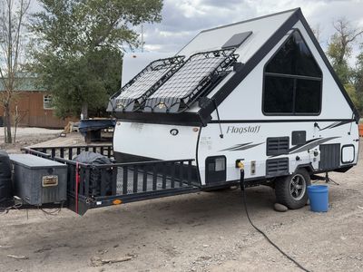 2021 Forest River Flagstaff hard sided pop up toy hauler camper