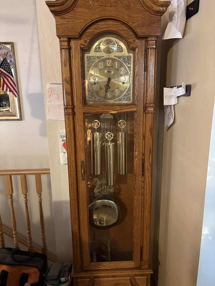 6 1/2 ‘ Howard Miller Traditional Oak Wood Grandfather Clock with Glass Door and Brass Pendulum