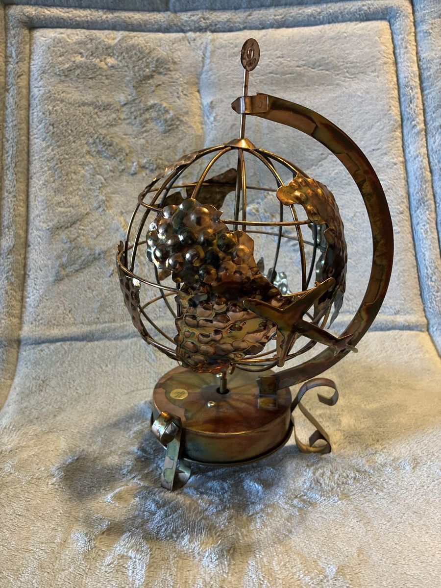 Decorative Copper Globe Desk Sculpture with Airplane Accent. Music box plays “it’s a small small world”