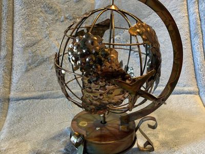 Decorative Copper Globe Desk Sculpture with Airplane Accent. Music box plays “it’s a small small world”