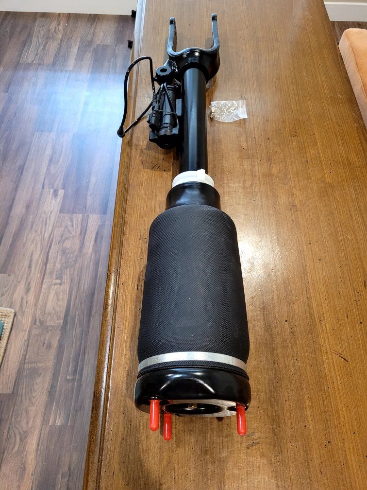 New aftermarket electronic front air suspension strut.