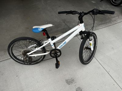 Co-op Cycles REV 20 Kids Mountain Bike White/Blue 20" Wheels Hardtail Suspension