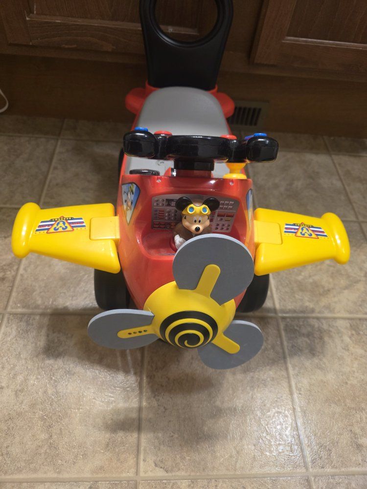 Mickey air plane riding bike