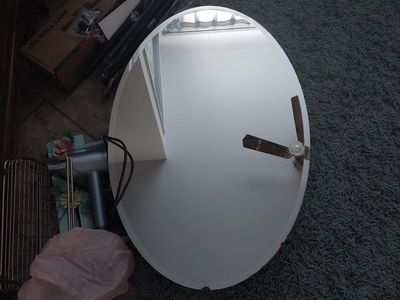 Oval beveled medicine cabinent