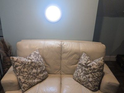 Cream Leather Loveseat Sofa - Compact 2-Seater, Good Condition
