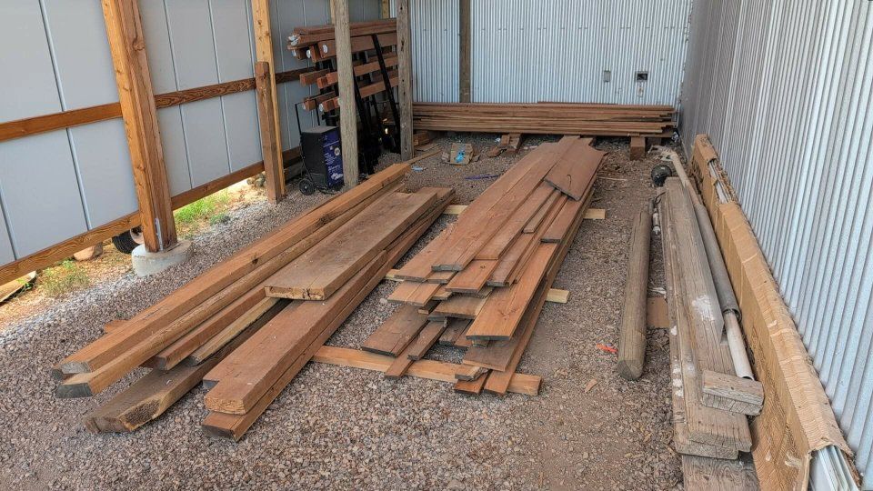 Assorted Hardwood Lumber & Live Edge Slabs Stack