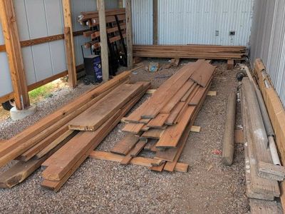 Assorted Hardwood Lumber & Live Edge Slabs Stack