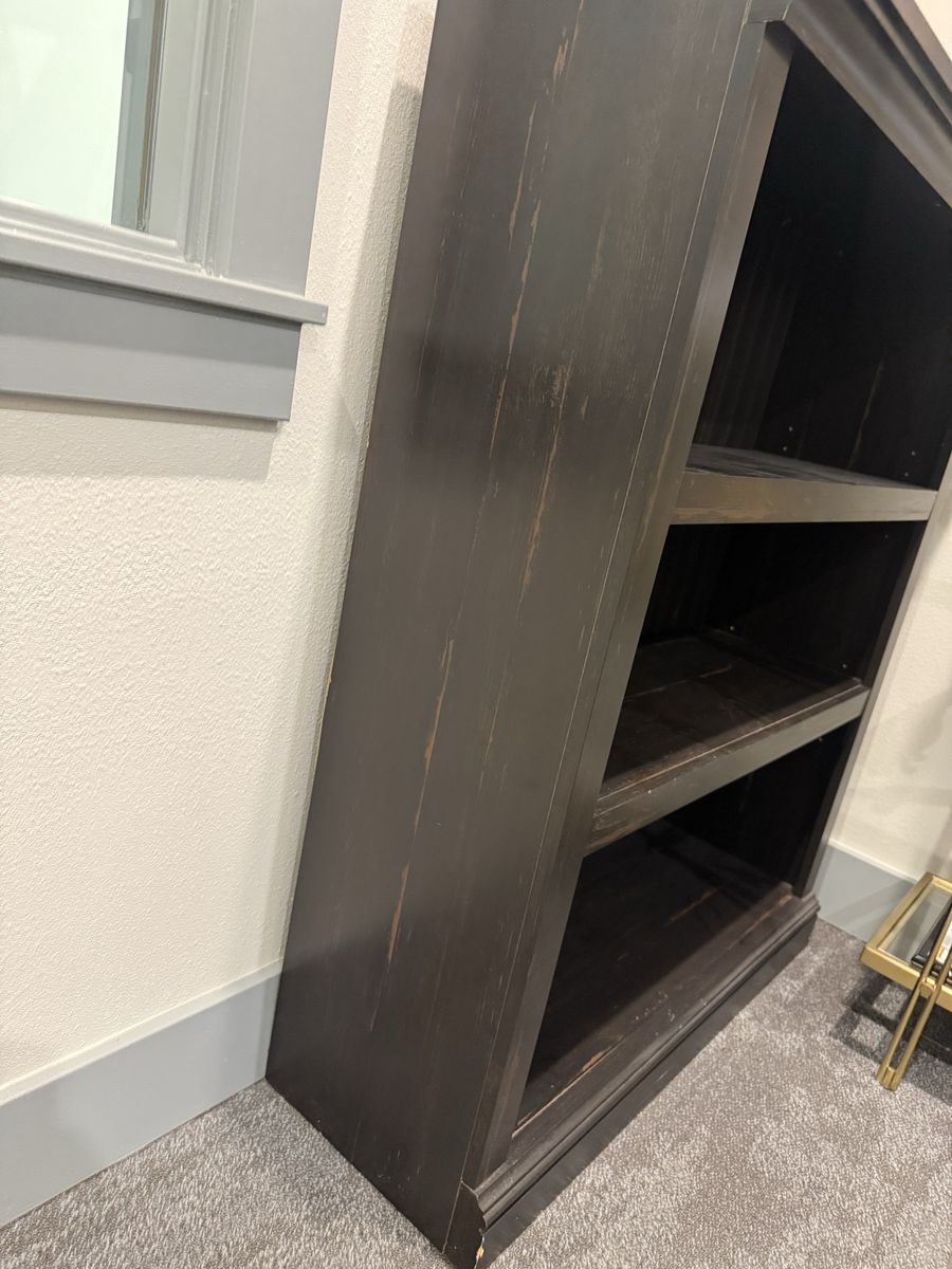Dark Distressed Wooden Bookshelf with Beadboard Backing