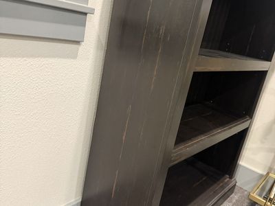 Dark Distressed Wooden Bookshelf with Beadboard Backing