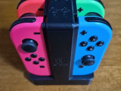 Nintendo Switch Joy-Con Controllers: Neon Red, Blue, green, pink Left Right 2 Pair with Charger included. Excellent Conditions!