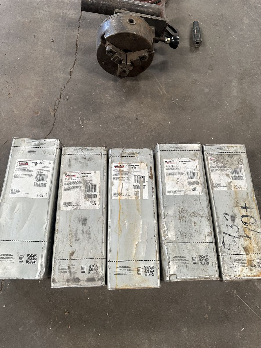 New unopened 50lb Lincoln welding rod cans