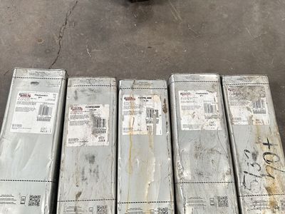 New unopened 50lb Lincoln welding rod cans