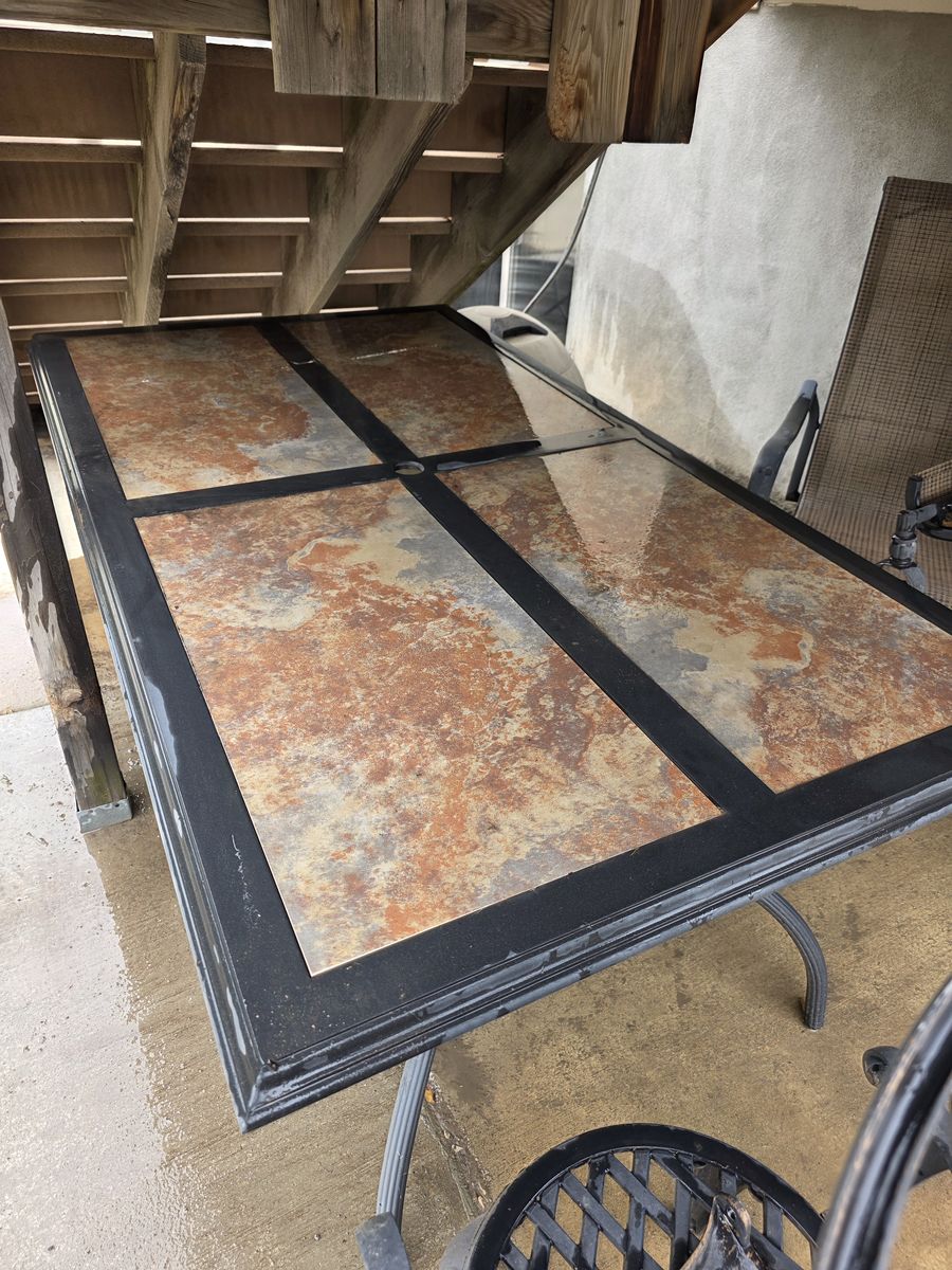 Patio table with umbrella and chairs