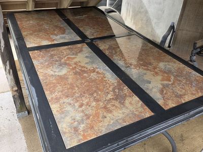 Patio table with umbrella and chairs