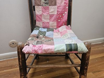 Antique rope chair with quilting