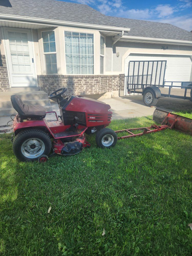 Toro Wheel Horse 264-H Riding Lawn Mower with Plow Attachment & Tire Chains
