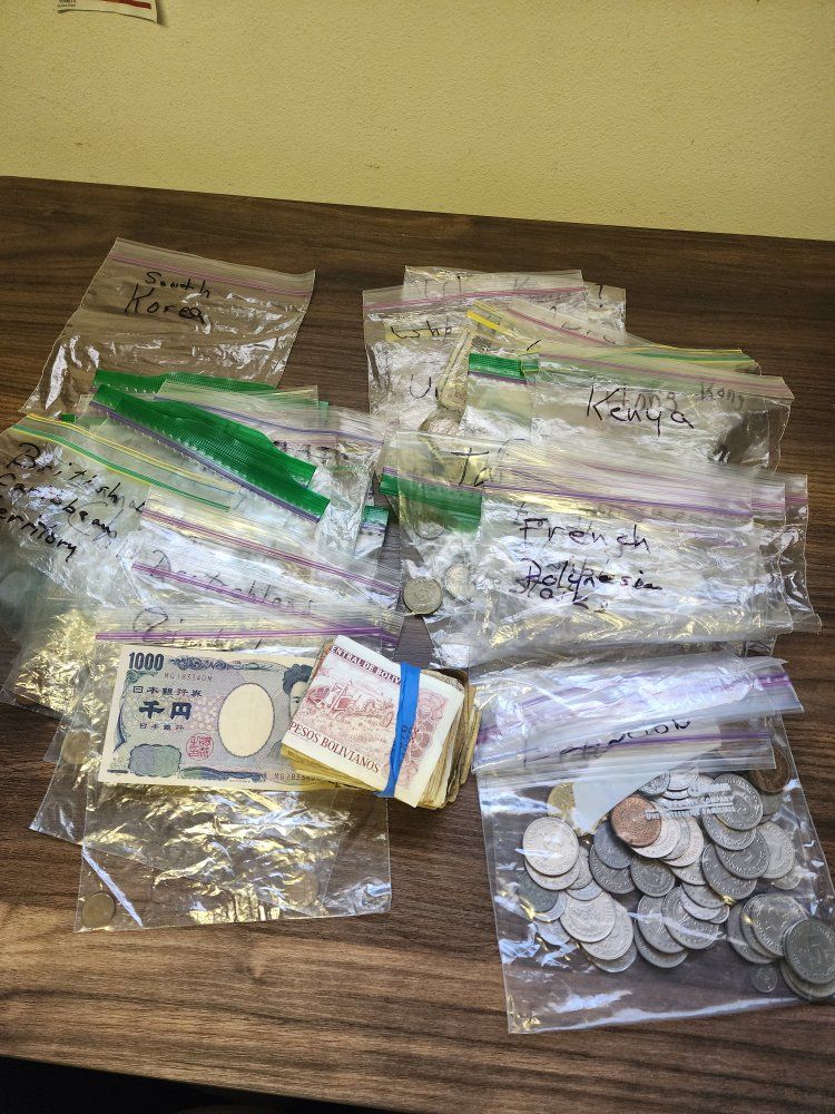 Global Coin & Currency Collection: Huge mixed lot from Bolivia, Japan, Korea & others. Includes several coins and bills.