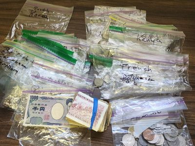 Global Coin & Currency Collection: Huge mixed lot from Bolivia, Japan, Korea & others. Includes several coins and bills.