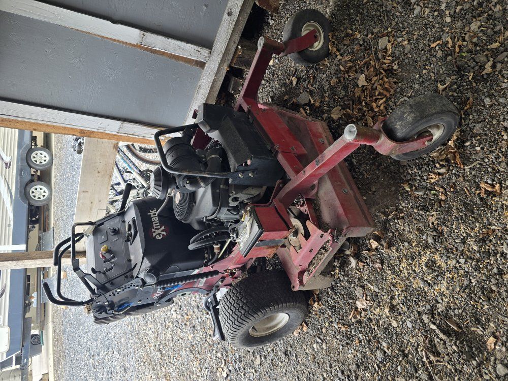eXmark stand behind mower