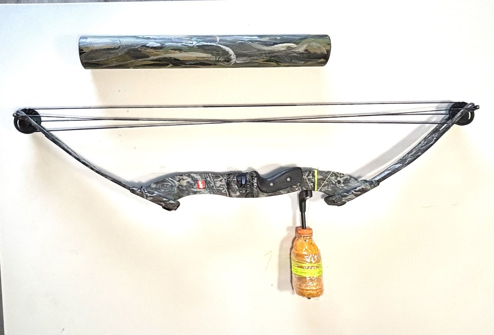 Mossy Oak PSE Nova Compound Bow with fishing line