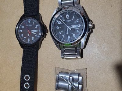 Two Citizen Eco-Drive Field Watches - Black Canvas & Stainless Steel Bands, Day/Date Display