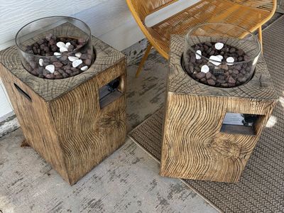 Glass & wood propane fire pit w/ covers.