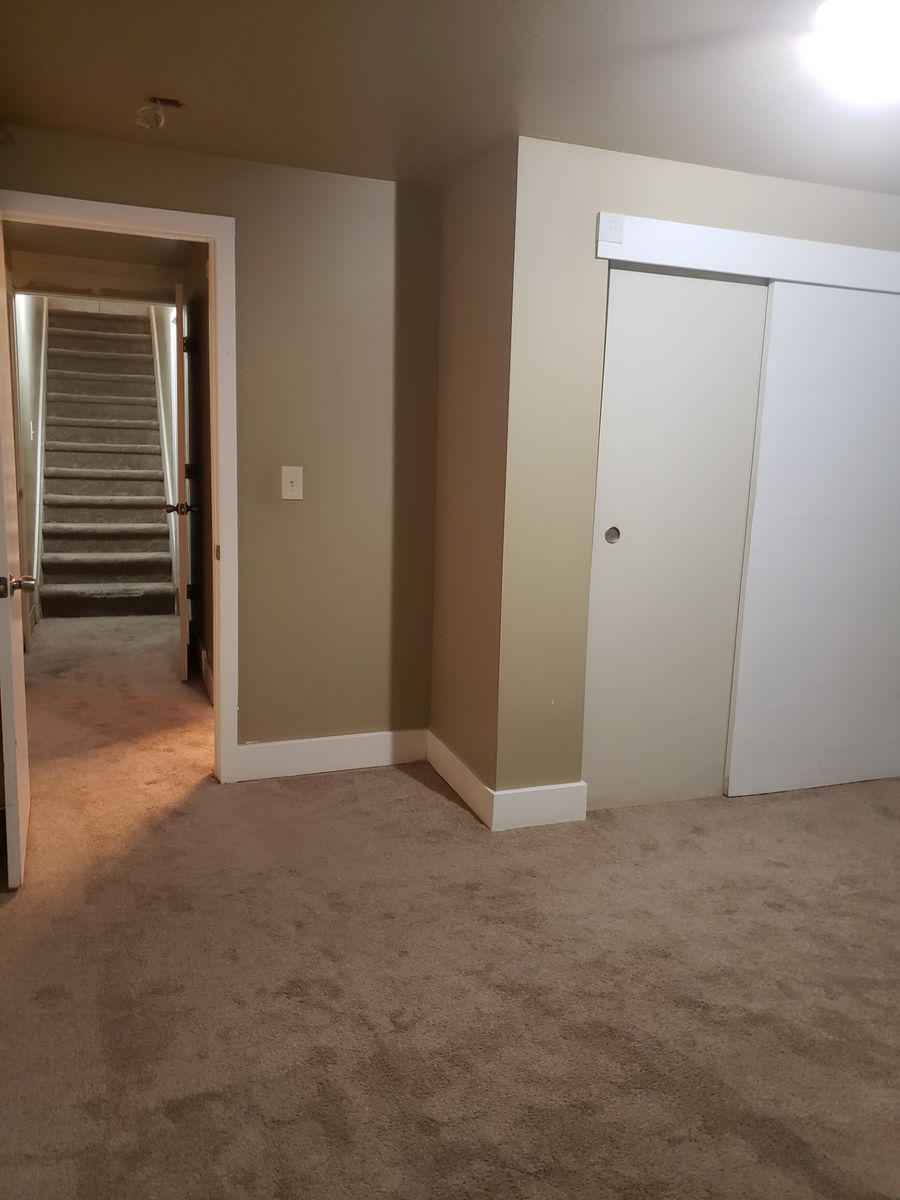 Bedroom, livingroom and private bathroom in house basement (new carpet)