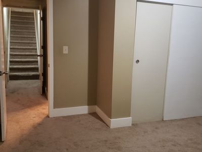 Bedroom, livingroom and private bathroom in house basement (new carpet)