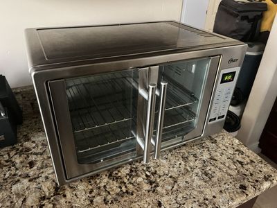 Oster air fryer oven 21 x 14 deep by 12 inches tall. Stainless steel ready to go located in Saratoga Spgs.