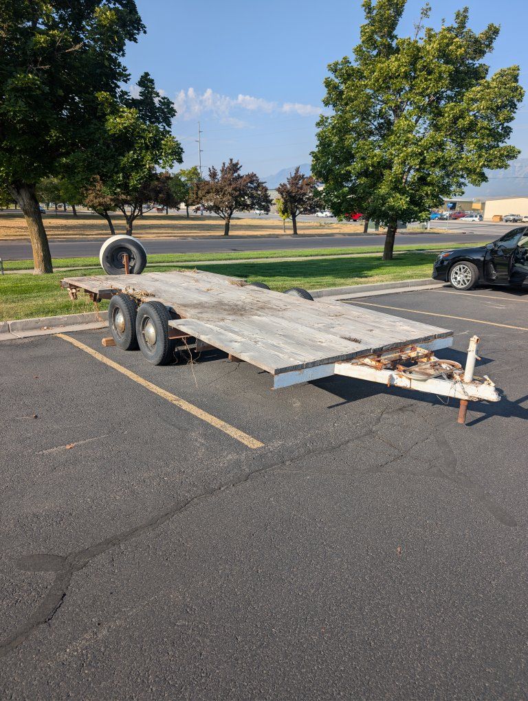 Tandem Axle Flatbed Utility Trailer with Wood Deck and Spare Tire Mount