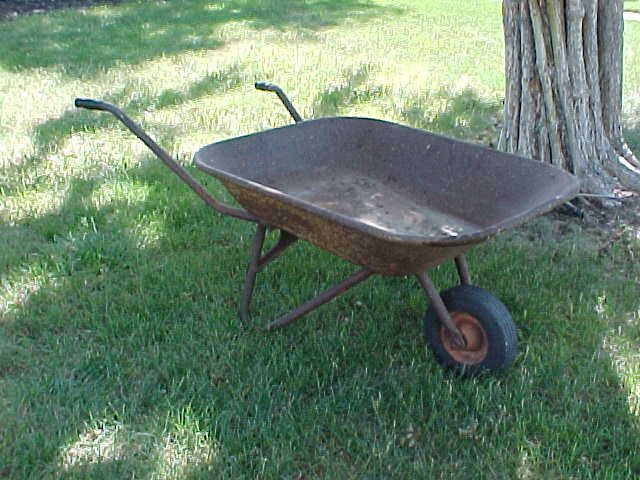 Antique wheelbarrow...all original including the tire and handle grips...65-85 years old