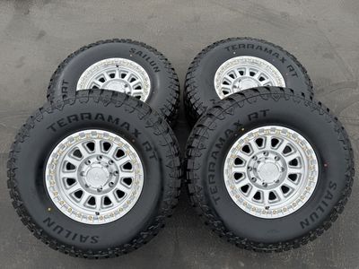 New 35x12.50r17 RT Silver Arena 8x6.5 Ram Chevy 8