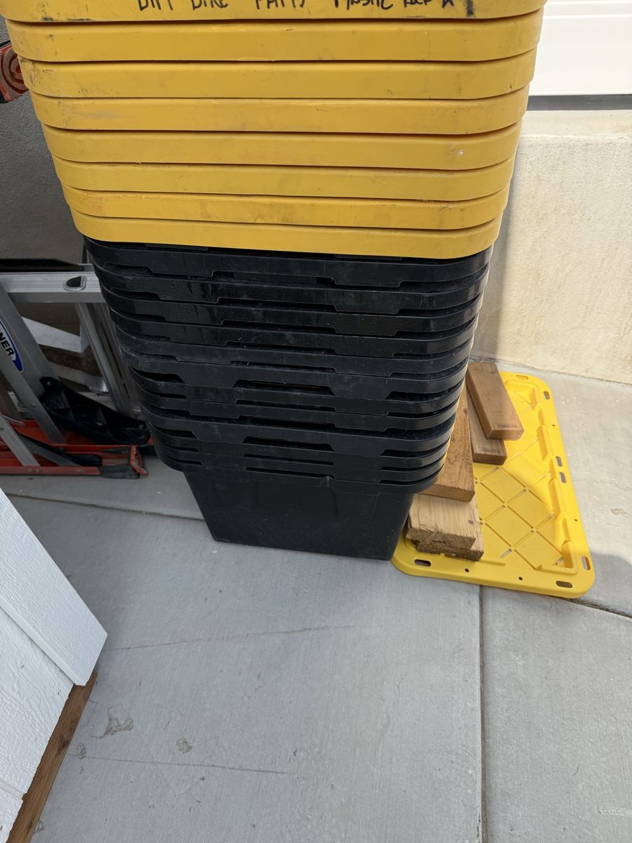 Stack of Greenmade Black and Yellow Plastic Storage Totes with Lids