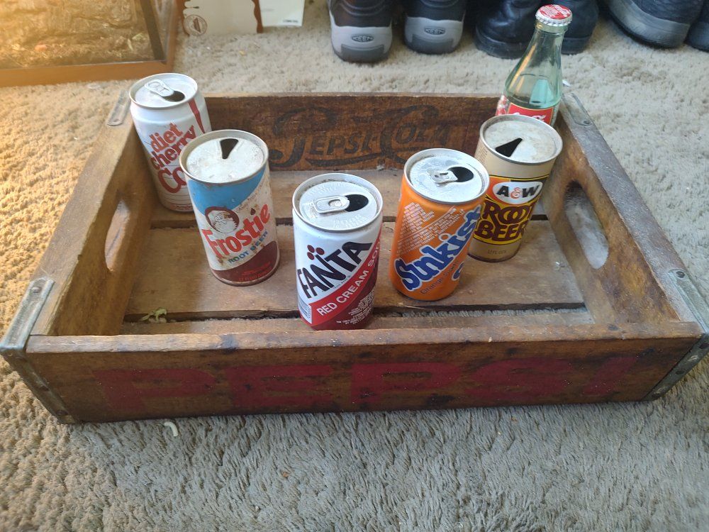 old Pepsi crate with cans