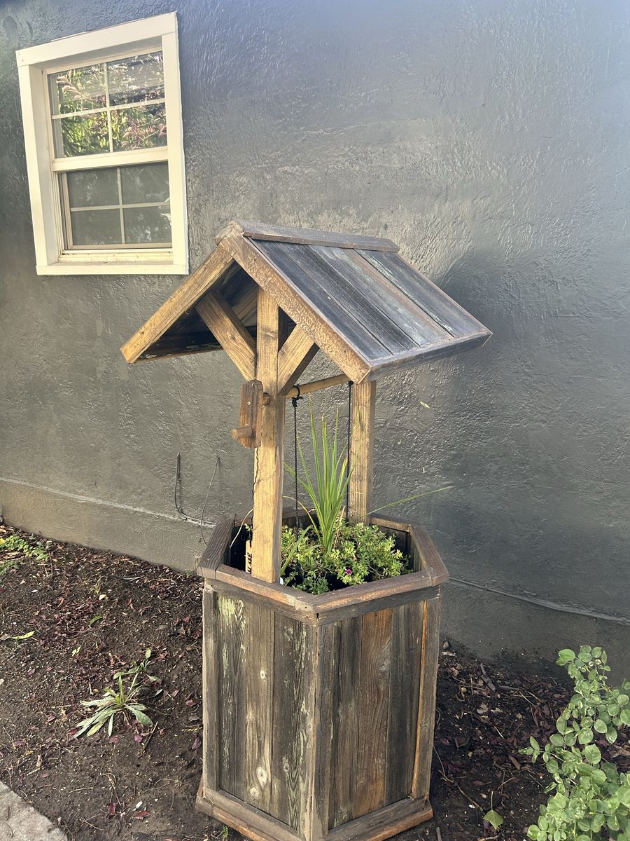 Homemade wooden wishing well